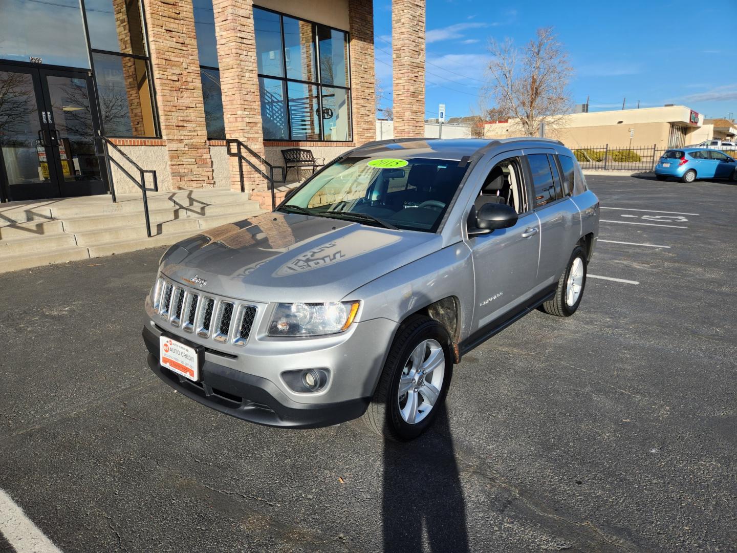 2015 Billet Silver Metallic Clearcoat /Dark Slate Gray Jeep Compass Sport (1C4NJDBB9FD) with an 2.4L I4 DOHC 16V Dual VVT engine, Automatic transmission, located at 10890 W. Colfax Ave., Lakewood, CO, 80215, (303) 274-7692, 39.739914, -105.120132 - 2015 Jeep Compass<br><br>D1 Auto NEVER charges dealer fees! All cars have clean titles and have been inspected for mechanical issues. We have financing for everyone. Good credit, bad credit, first time buyers.<br><br>Please call Lakewood Location 303-274-7692 or Thornton 303-287-5511 to schedule a t - Photo#1